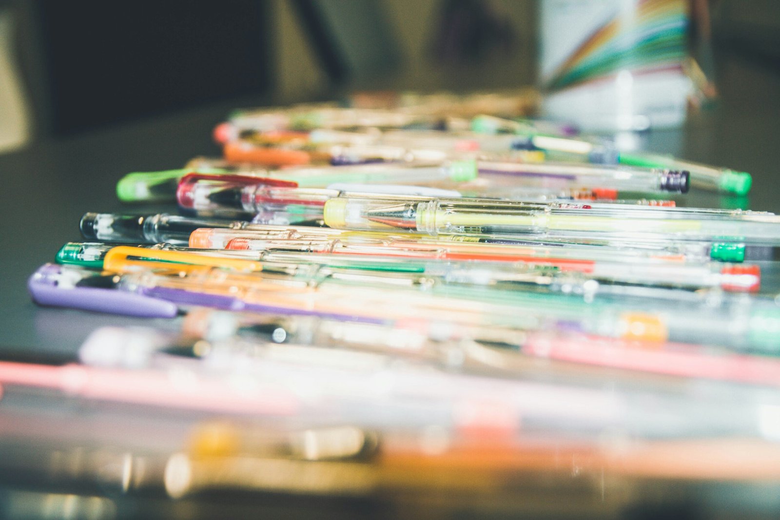 assorted-color pen on table